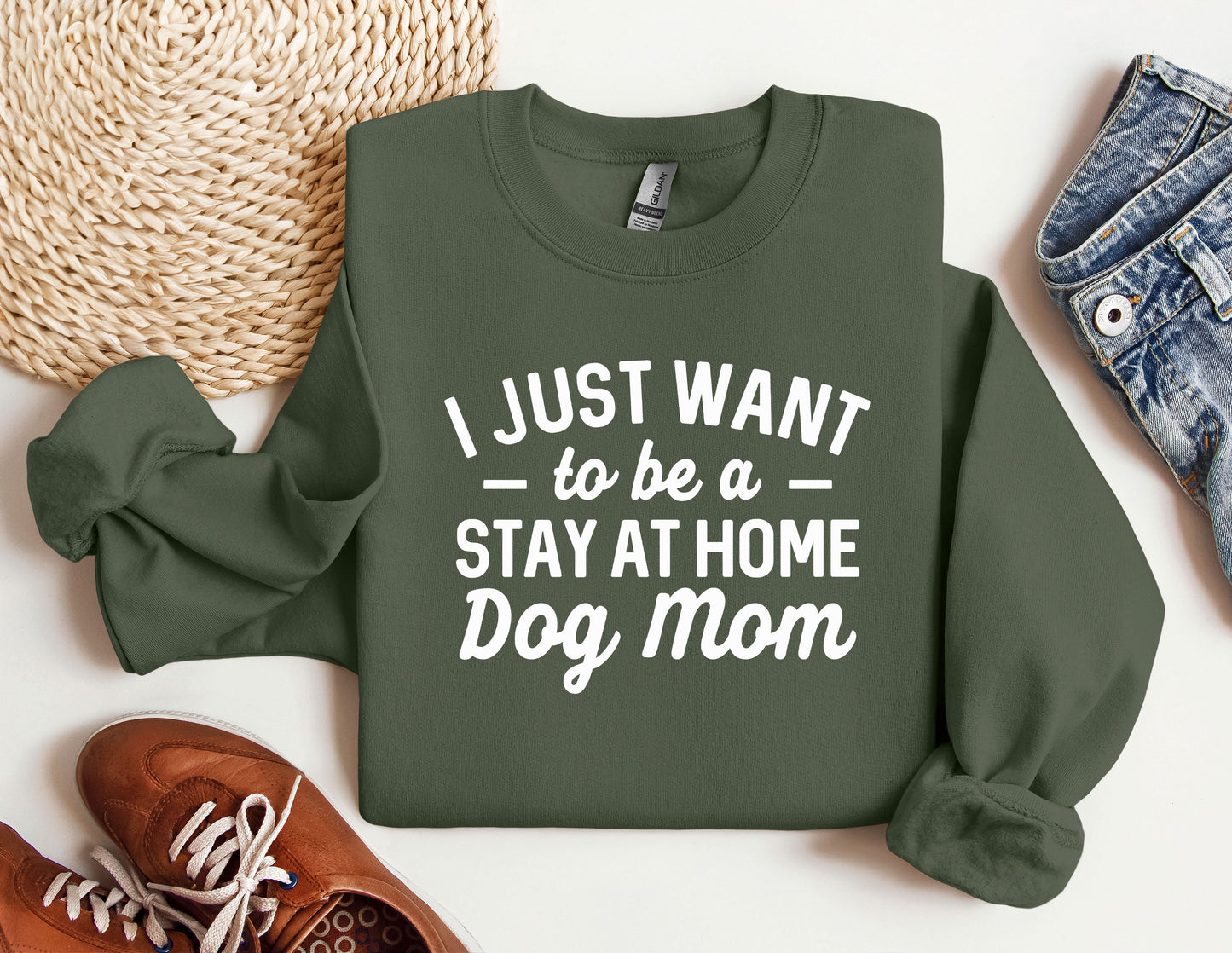 a green sweatshirt that says i just want to be a stay at home dog mom