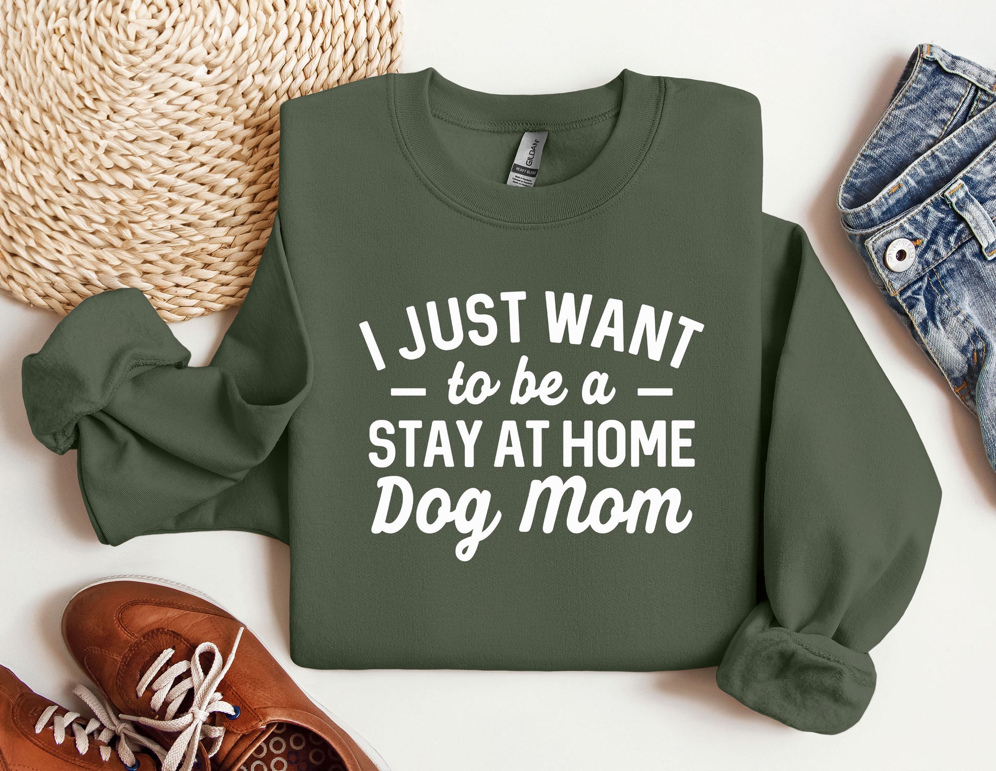 a green sweatshirt that says i just want to be a stay at home dog mom