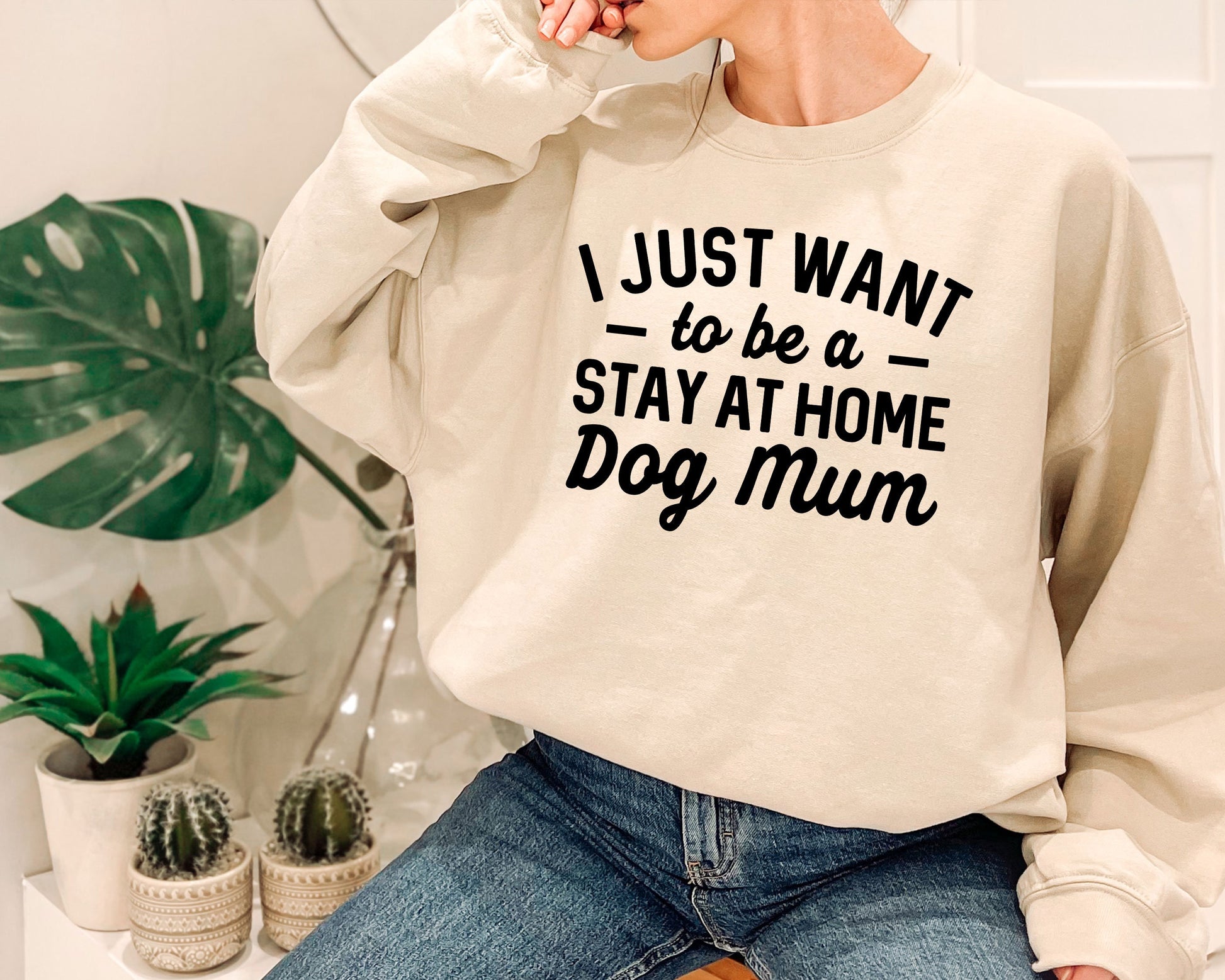 a woman wearing a sweatshirt that says i just want to be a stay at home