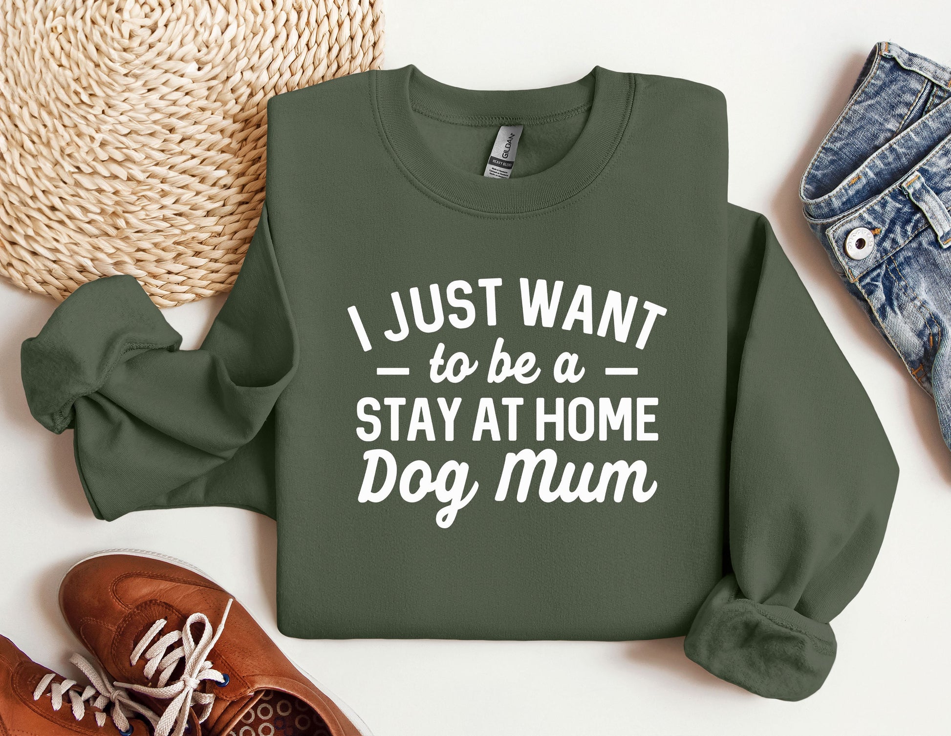 a green sweatshirt that says i just want to be a stay at home dog mum