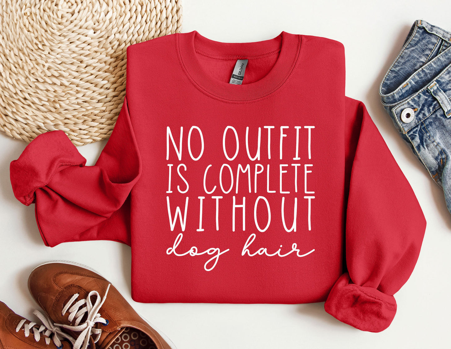 a red sweatshirt with the words, no outfit is complete without leg hair