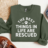 a green sweatshirt that says the best things in life are recorded