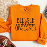 an orange shirt that says, blessing and an orange sweatshirt