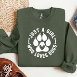 a green sweatshirt with a white dog paw on it