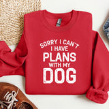 a red sweatshirt that says sorry i can't i have plans with my dog