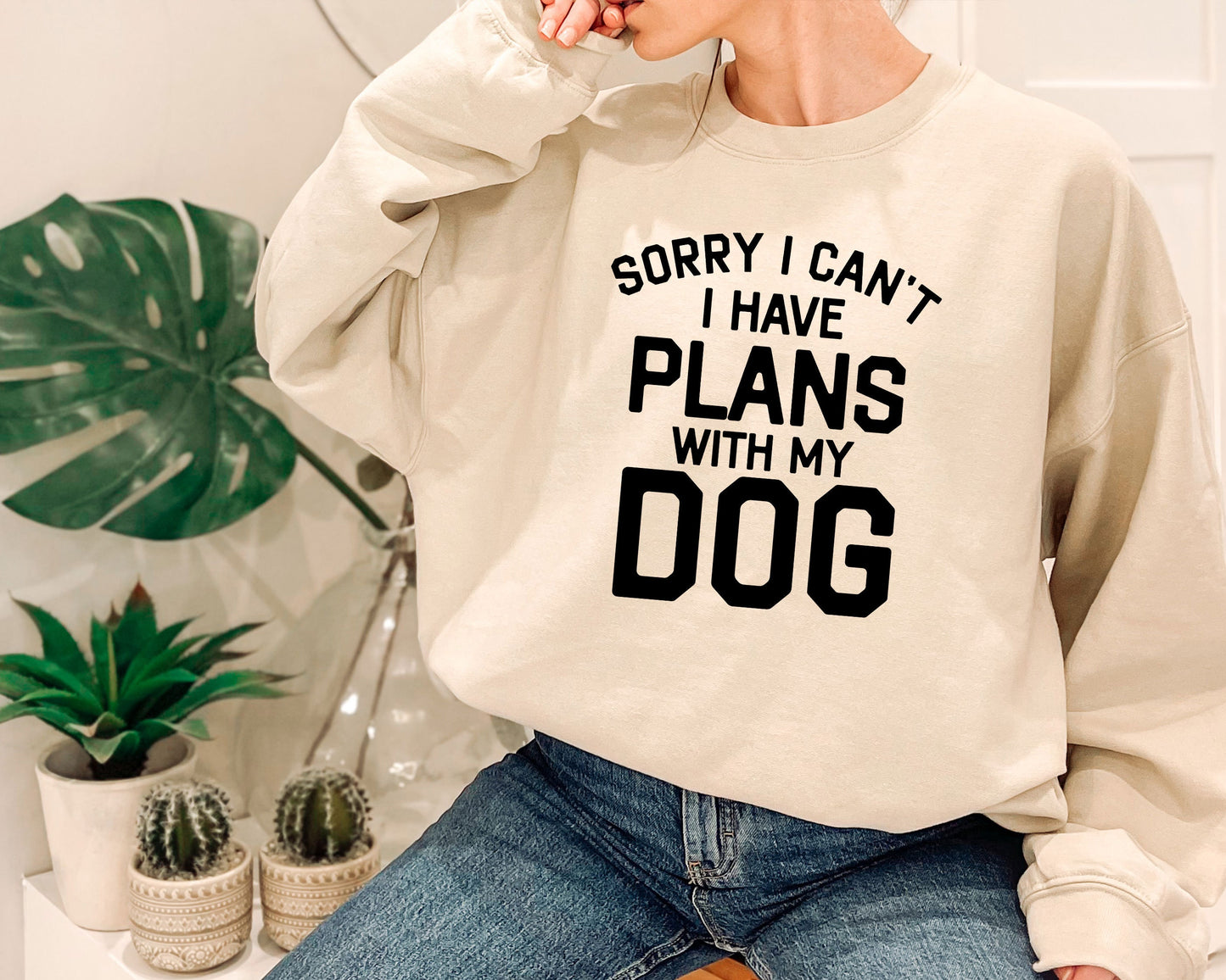a woman wearing a sweatshirt that says sorry i can&#39;t i have plans with