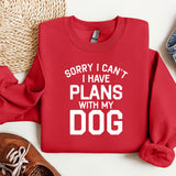 a red sweatshirt that says sorry i can't i have plans with my dog