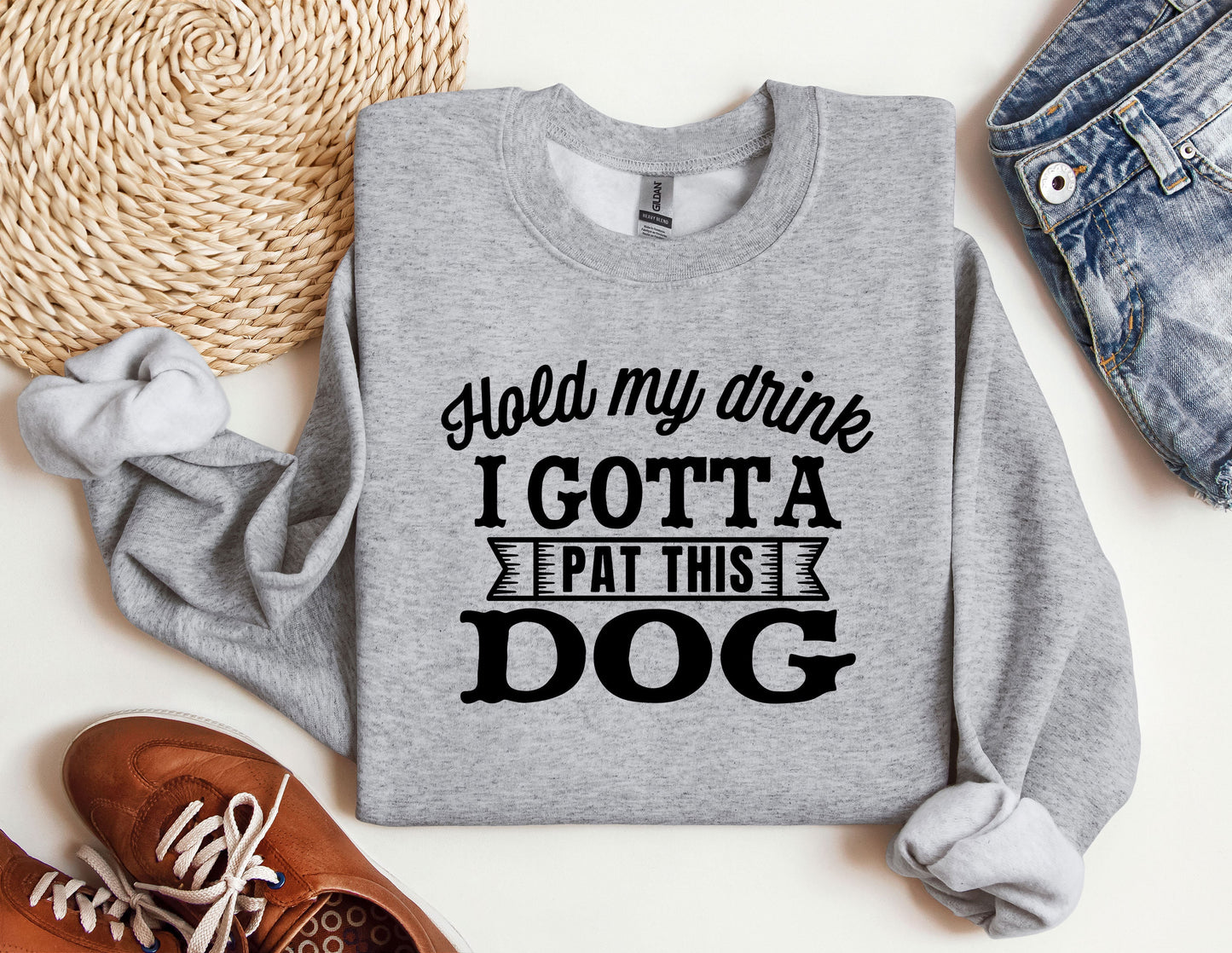 a sweatshirt that says hold my drink i got a pat this dog