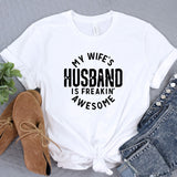 a t - shirt that says, my wife's husband is freakin '