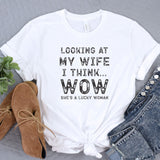 a t - shirt that says looking at my wife i think wow she's