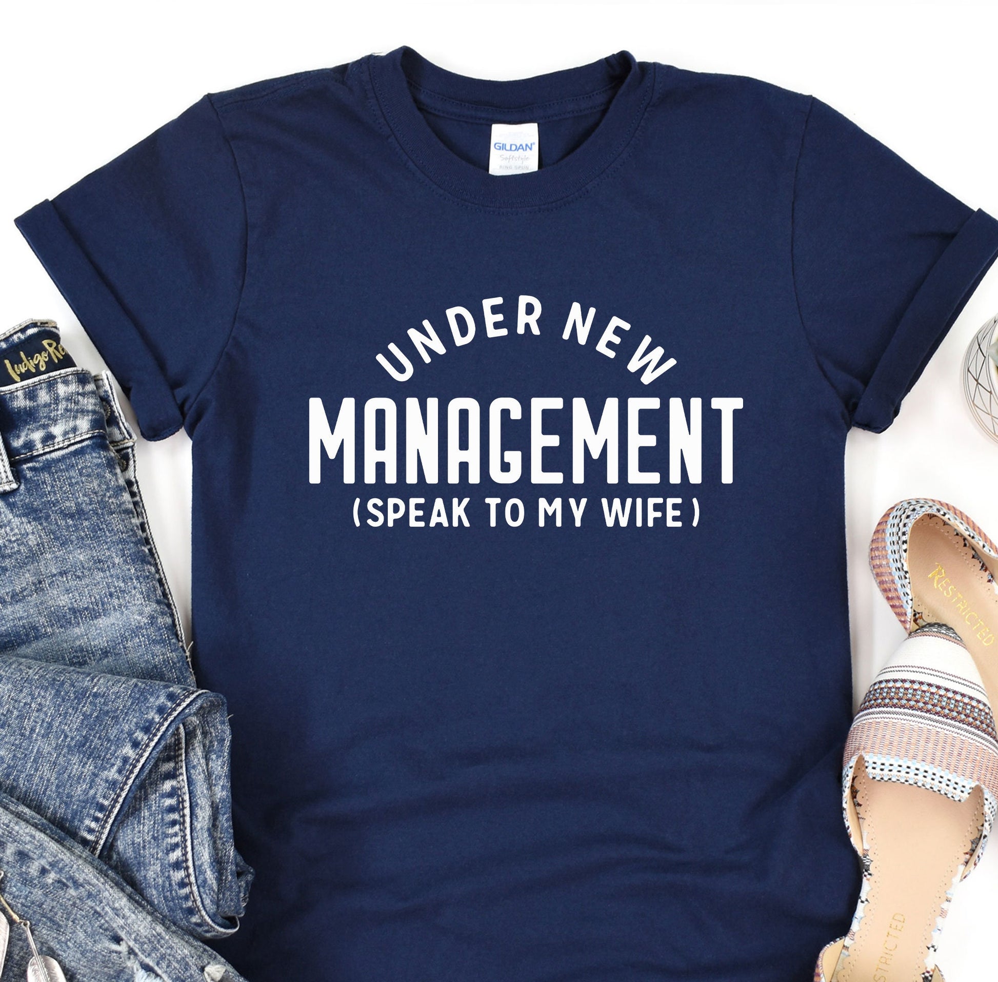 a t - shirt that says under new management speak to my wife