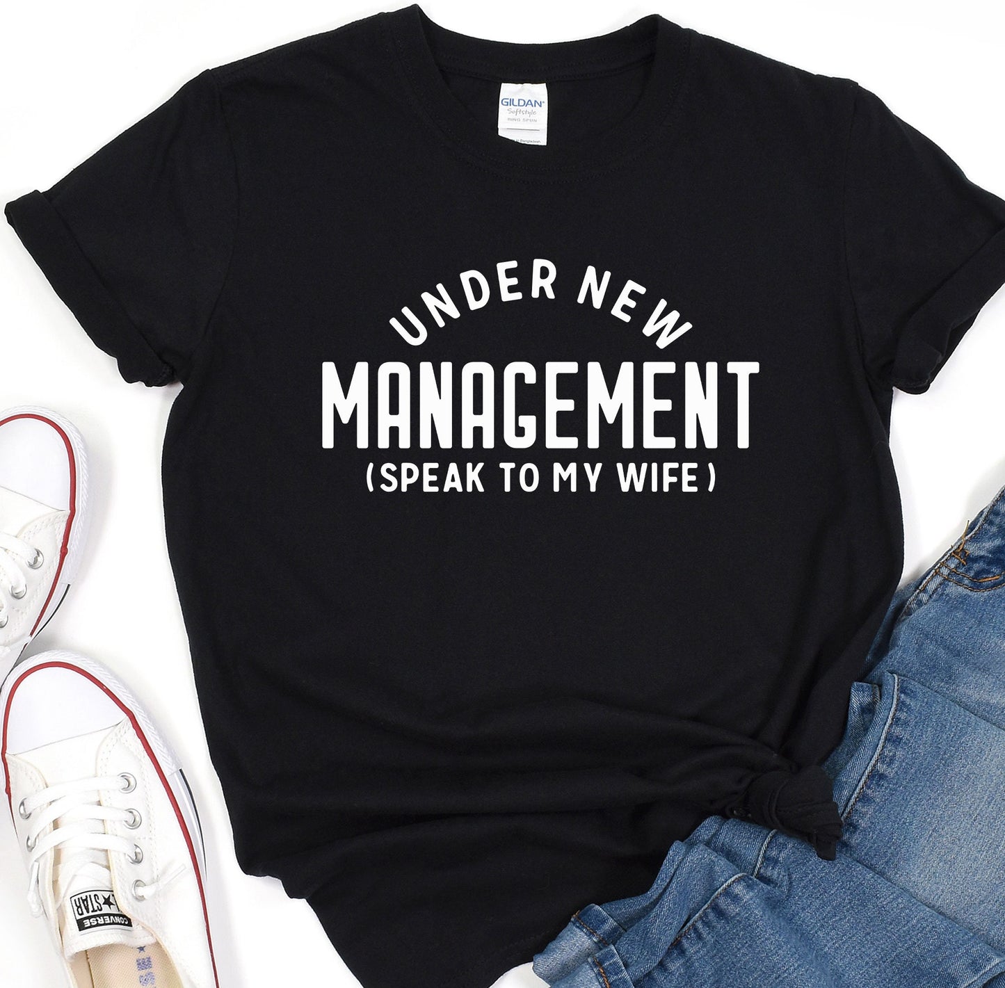 a t - shirt that says under new management speak to my wife