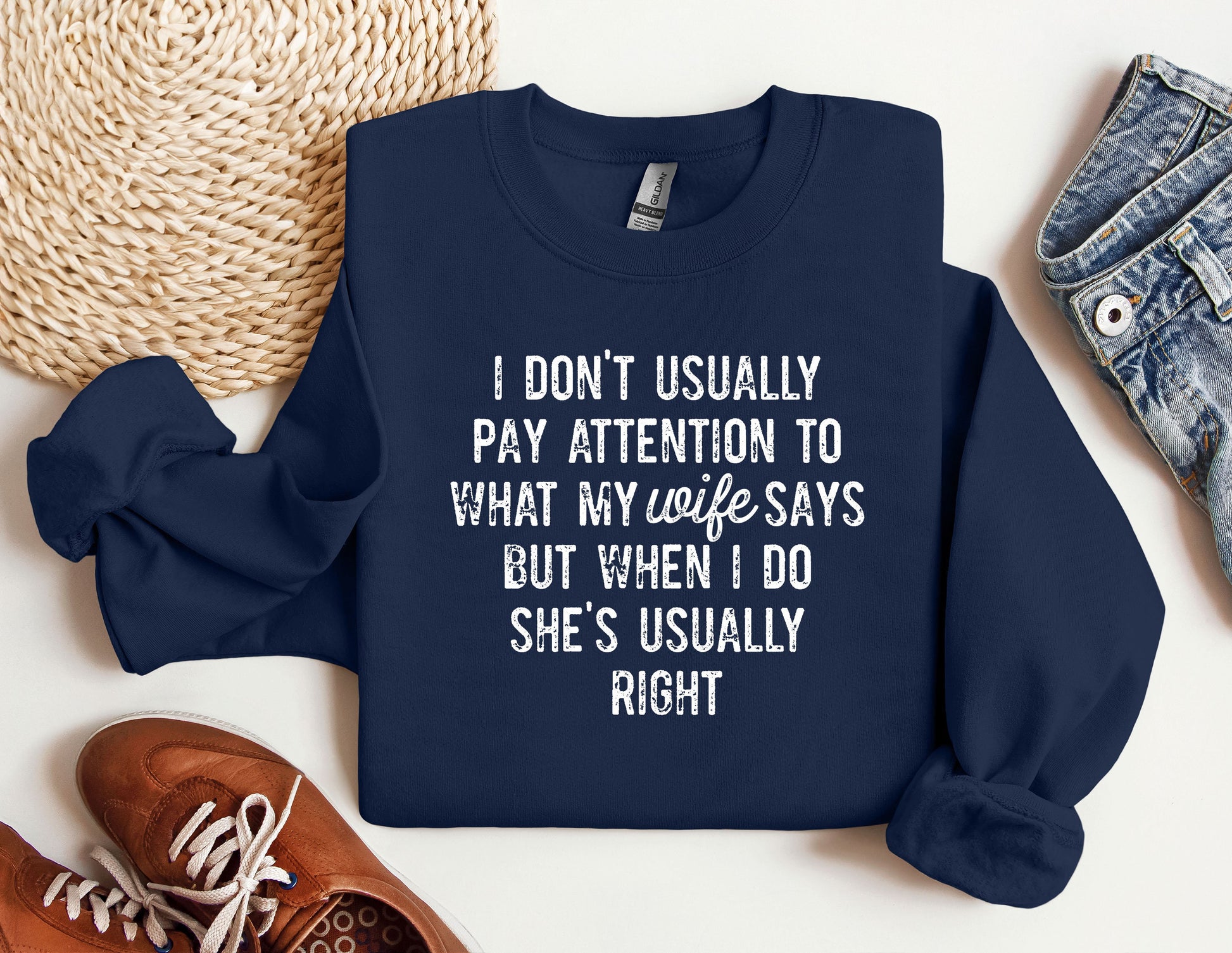 a sweatshirt with a quote on it next to a pair of shoes