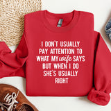 a red sweatshirt with a quote on it