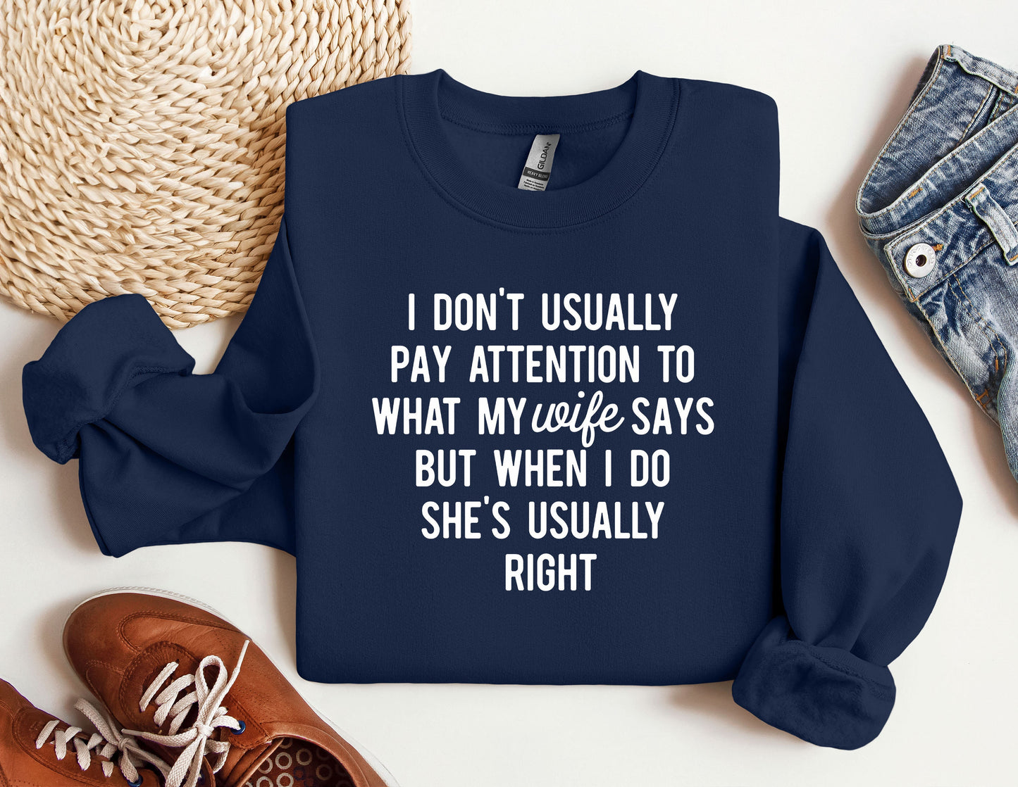 a sweatshirt with a quote on it next to a pair of shoes