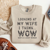 a sweater that says looking at my wife i think wow she's a lucky