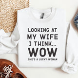 a sweater that says looking at my wife i think wow she's a lucky