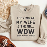 a sweater that says looking at my wife i think wow she's a lucky