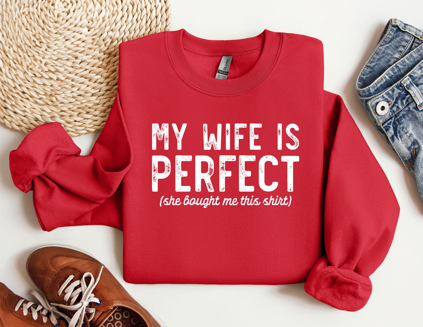 a red sweatshirt that says, my wife is perfect she bought me this shirt