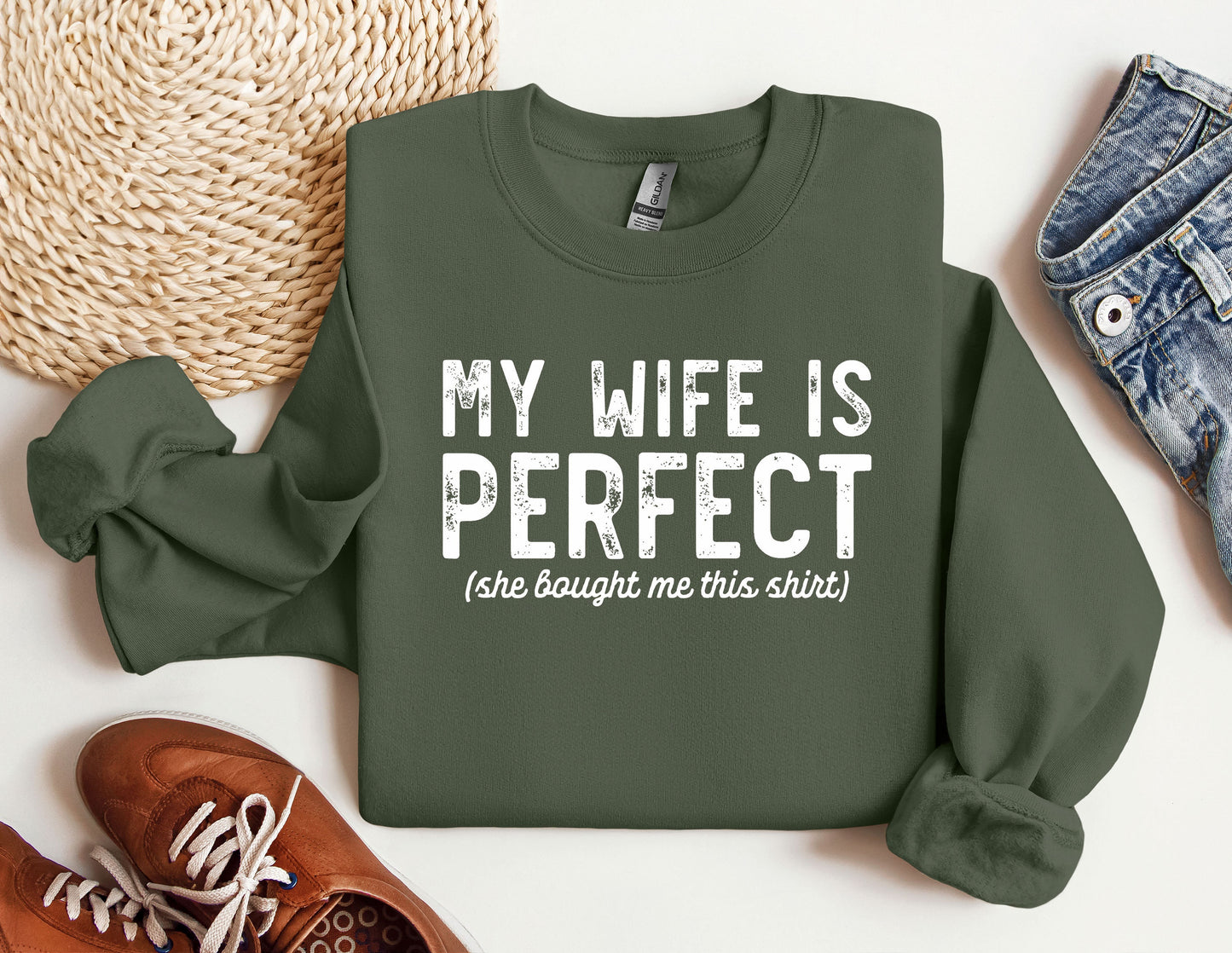 a green sweatshirt that says, my wife is perfect she bought me this shirt