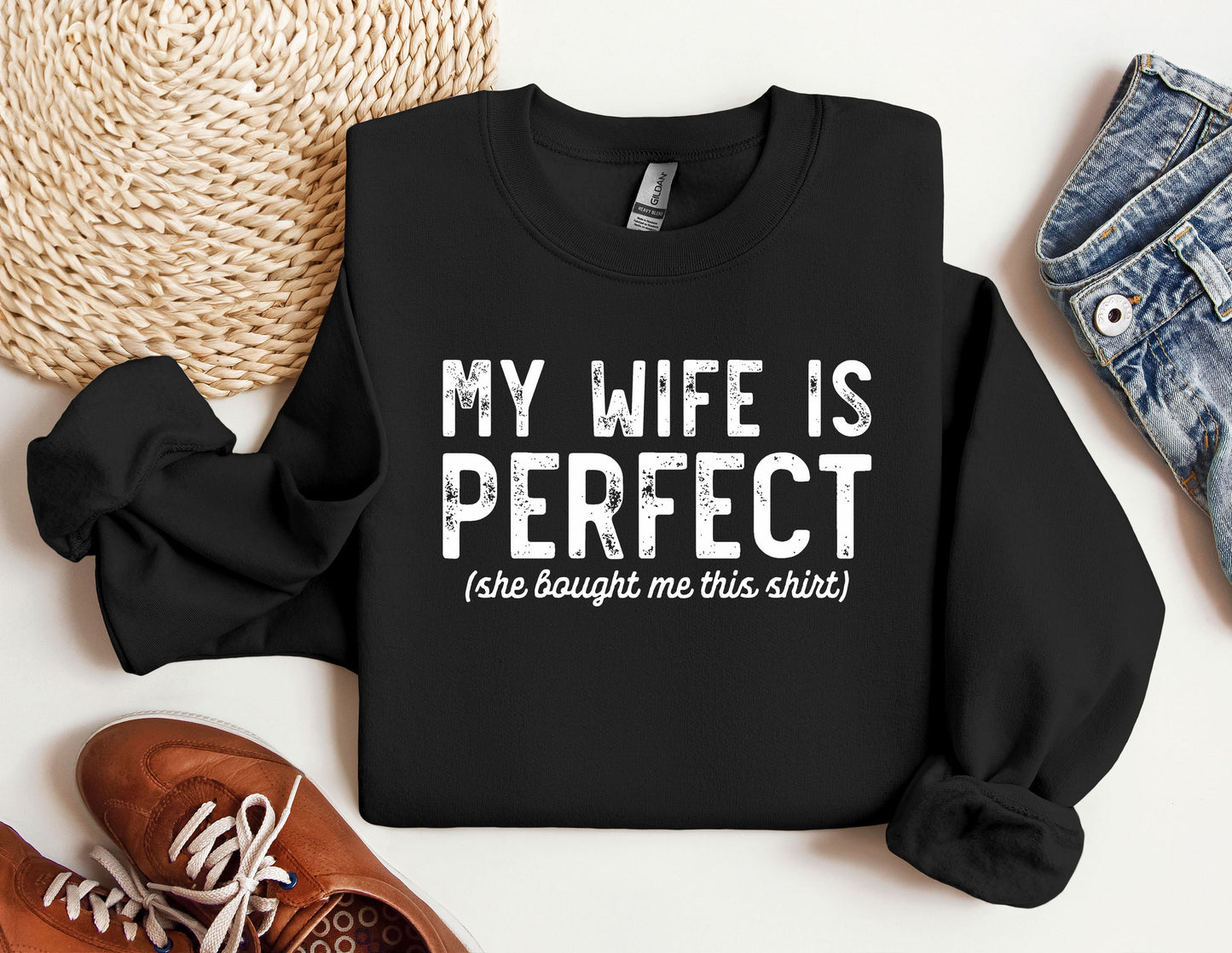 a black sweatshirt with the words my wife is perfect on it