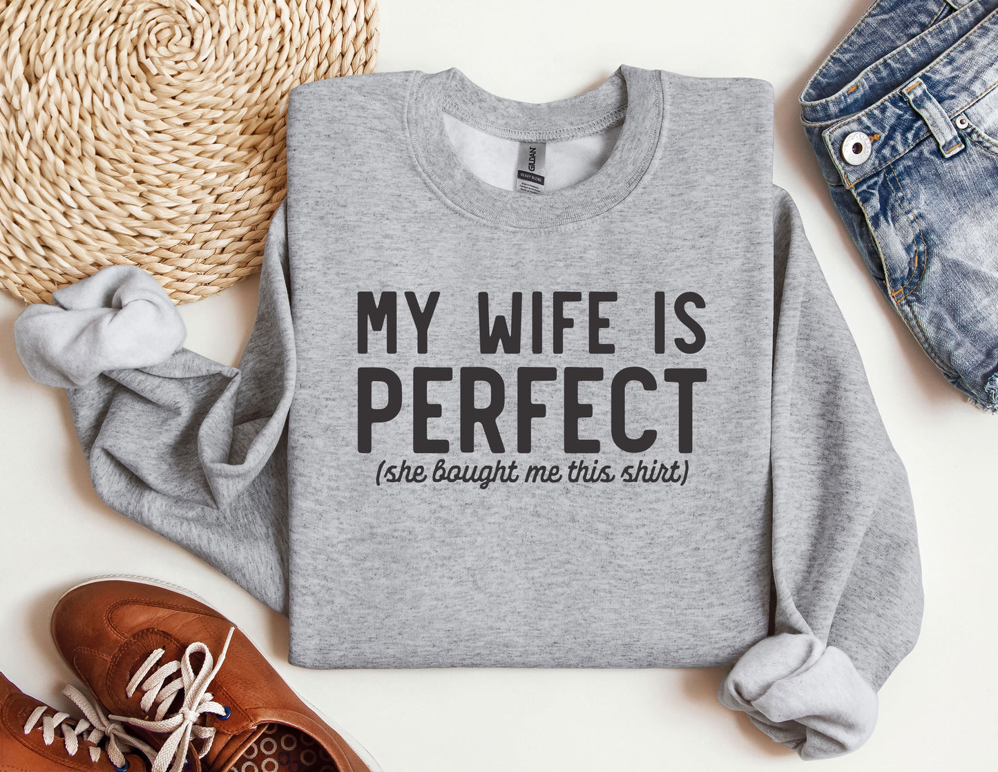 a sweater that says, my wife is perfect she bought me this shirt