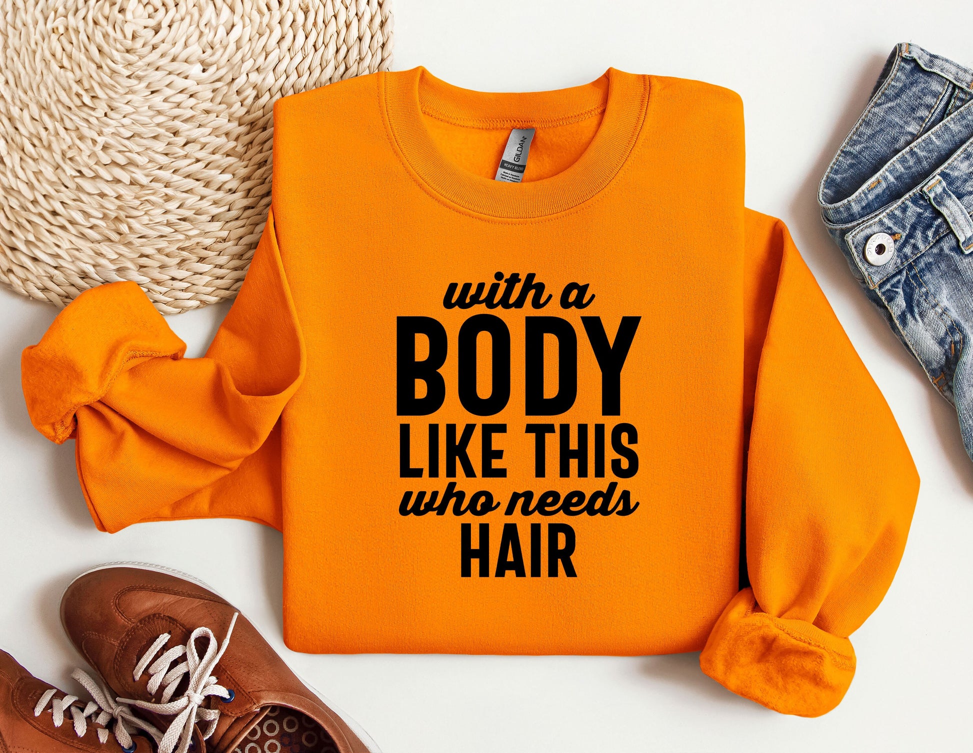 an orange sweatshirt with a message that says with a body like this who needs hair