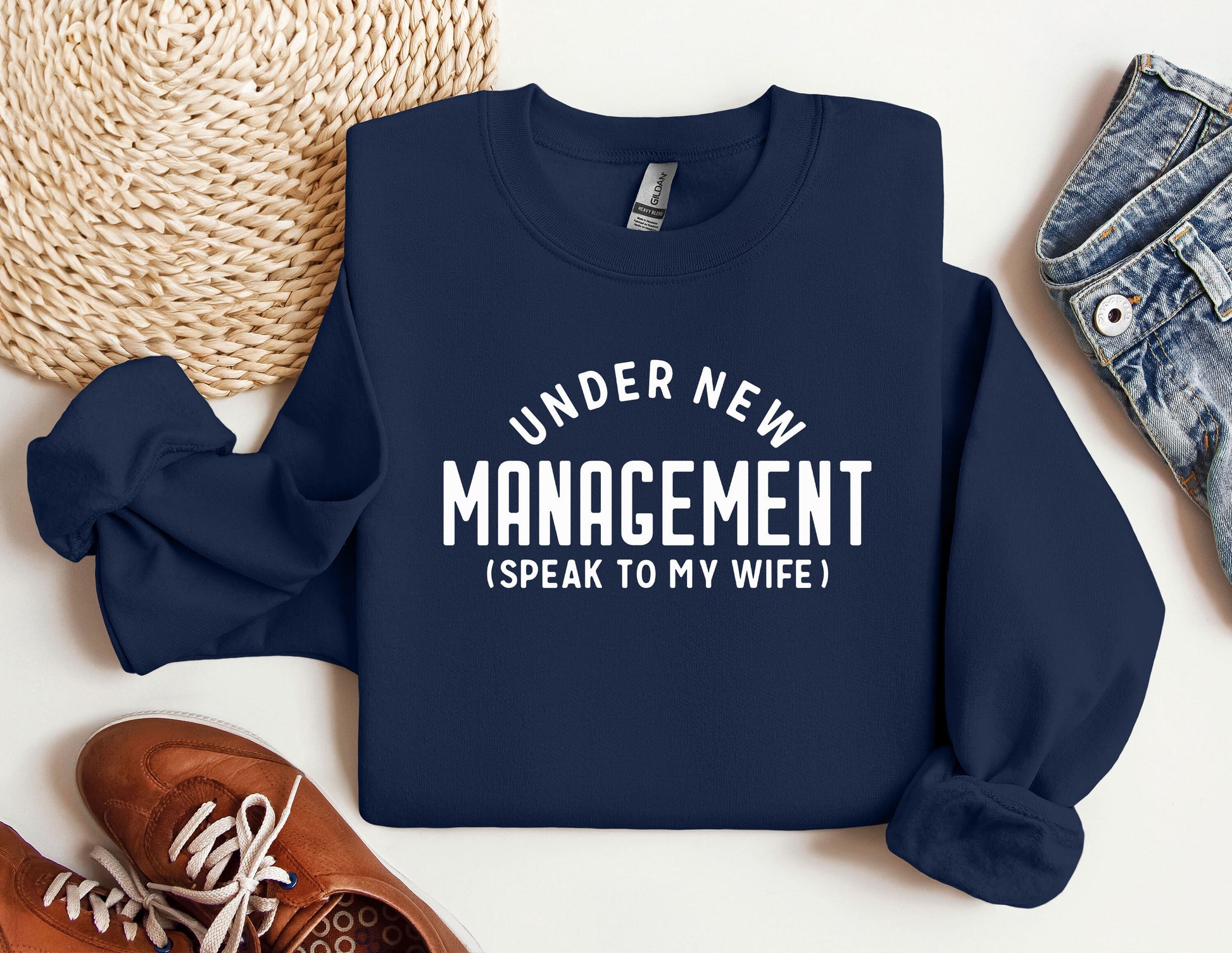 a sweater that says under new management i speak to my wife
