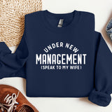 a sweater that says under new management i speak to my wife
