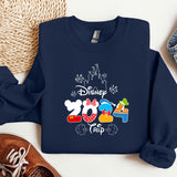 a mickey mouse shirt and some shoes on a table