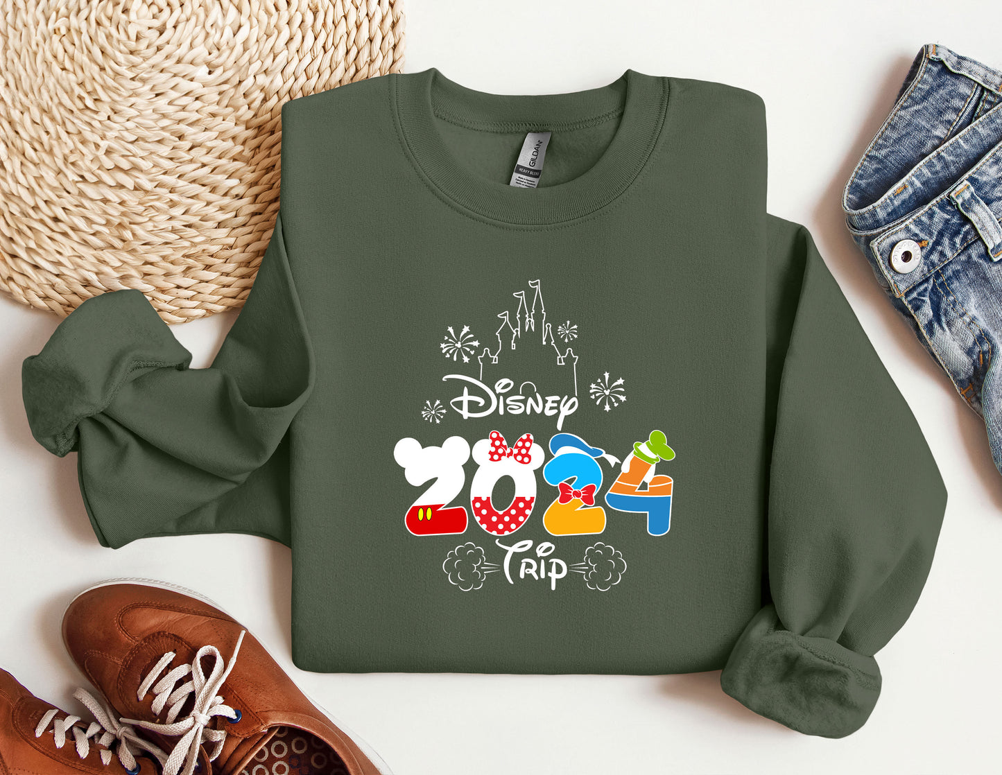 a green sweatshirt with mickey mouse on it