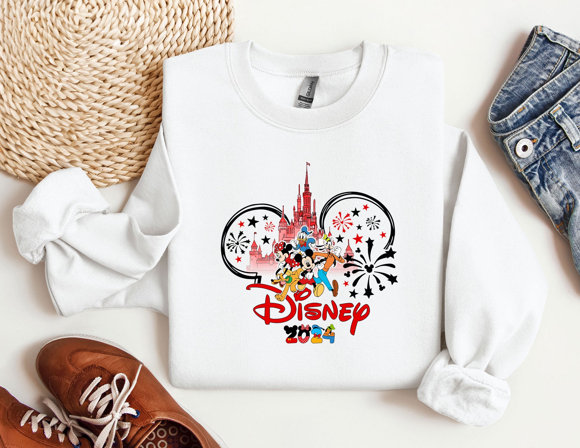 a white shirt with a mickey mouse design on it