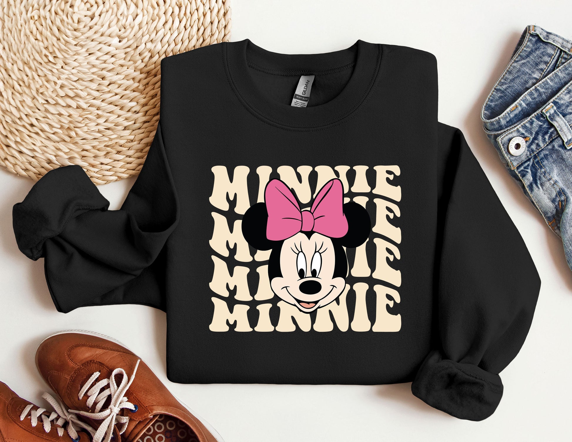 a black sweatshirt with a pink minnie mouse on it