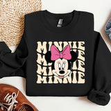 a black sweatshirt with a pink minnie mouse on it