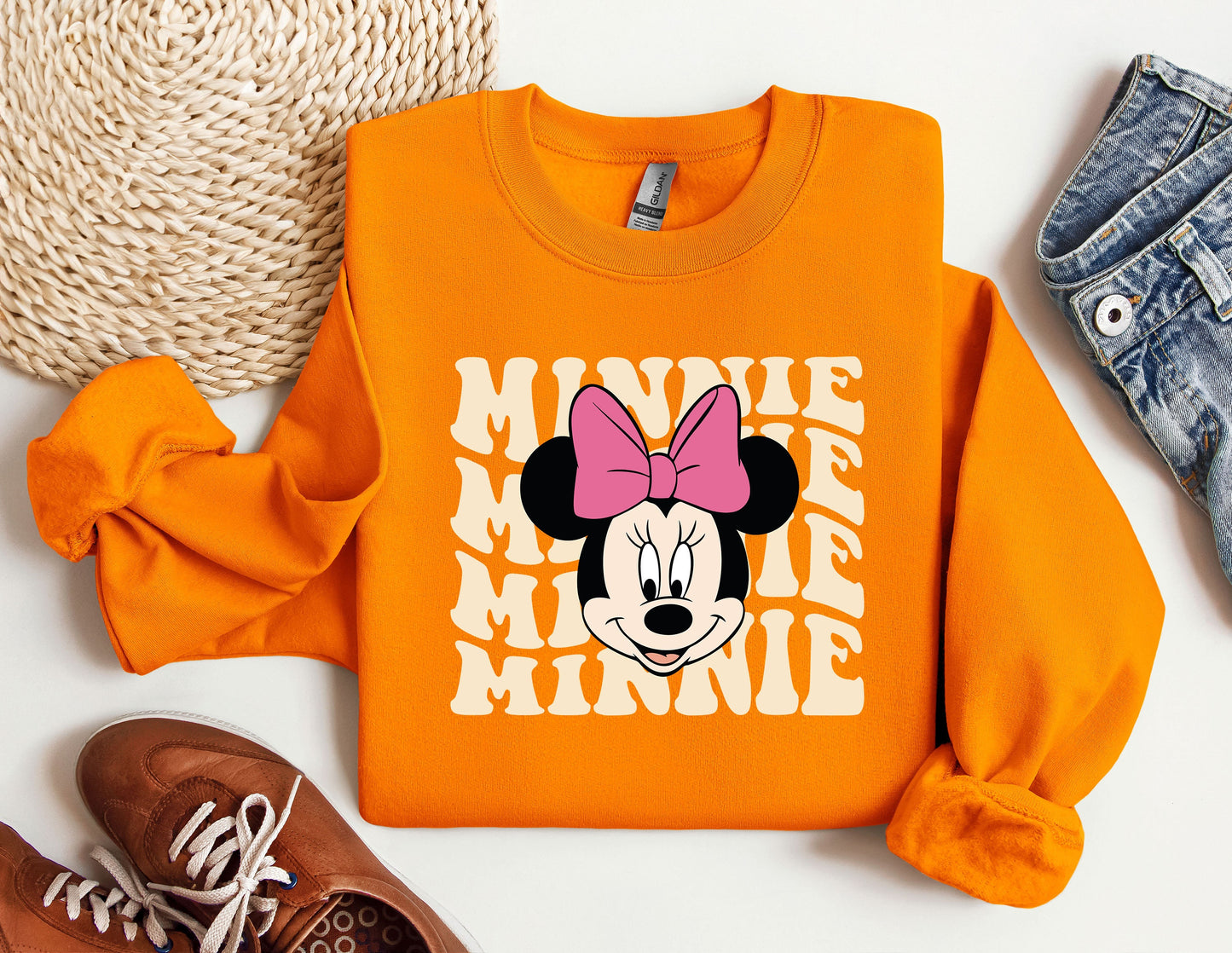 an orange shirt with a minnie mouse on it