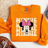 an orange shirt with a minnie mouse on it
