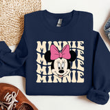 a blue sweatshirt with minnie mouse on it