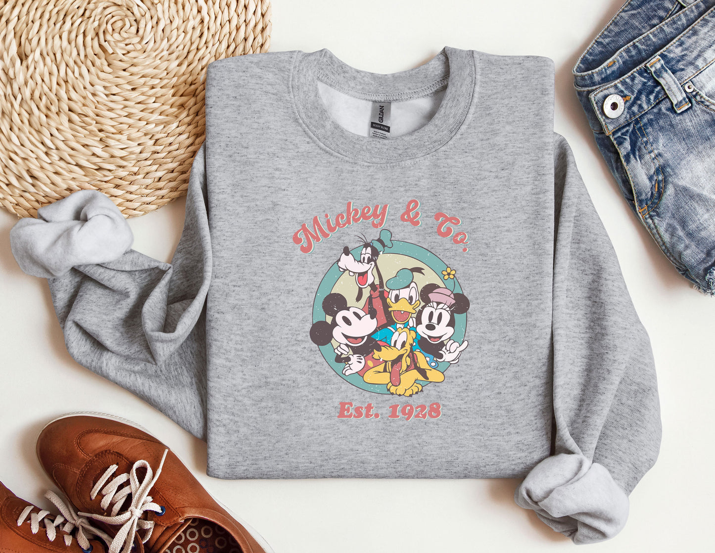 a sweatshirt with mickey and friends on it