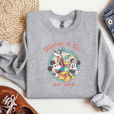 a sweatshirt with mickey and friends on it