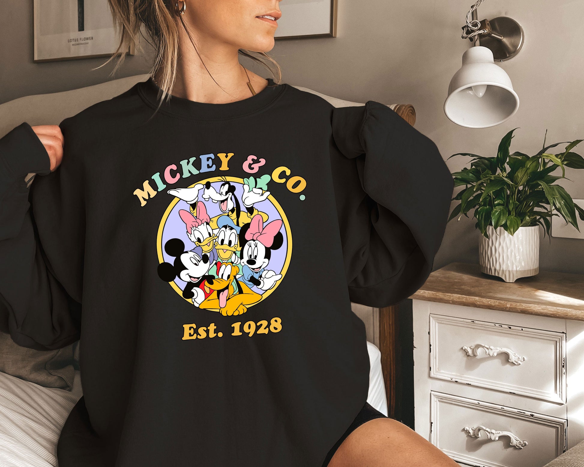 a woman in a mickey and mickey mouse shirt