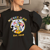 a woman in a mickey and mickey mouse shirt