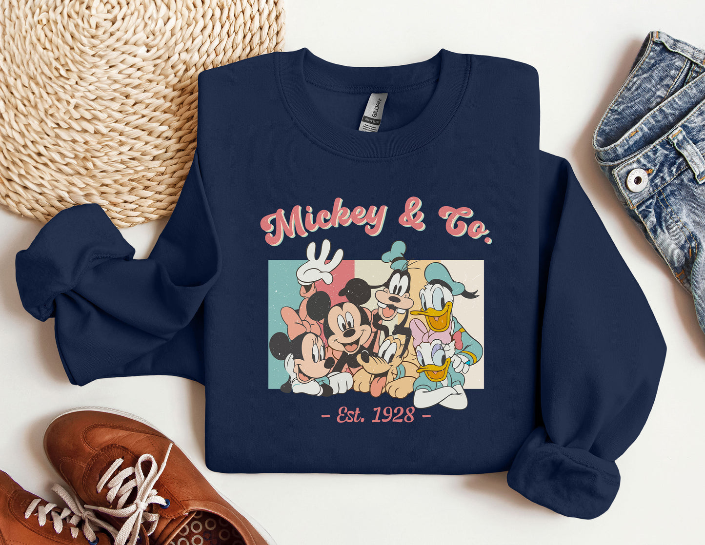 a sweatshirt with a picture of mickey and friends on it