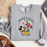 a mickey and mickey mouse shirt next to a pair of shoes