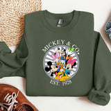 a mickey and mickey mouse shirt next to a pair of sneakers