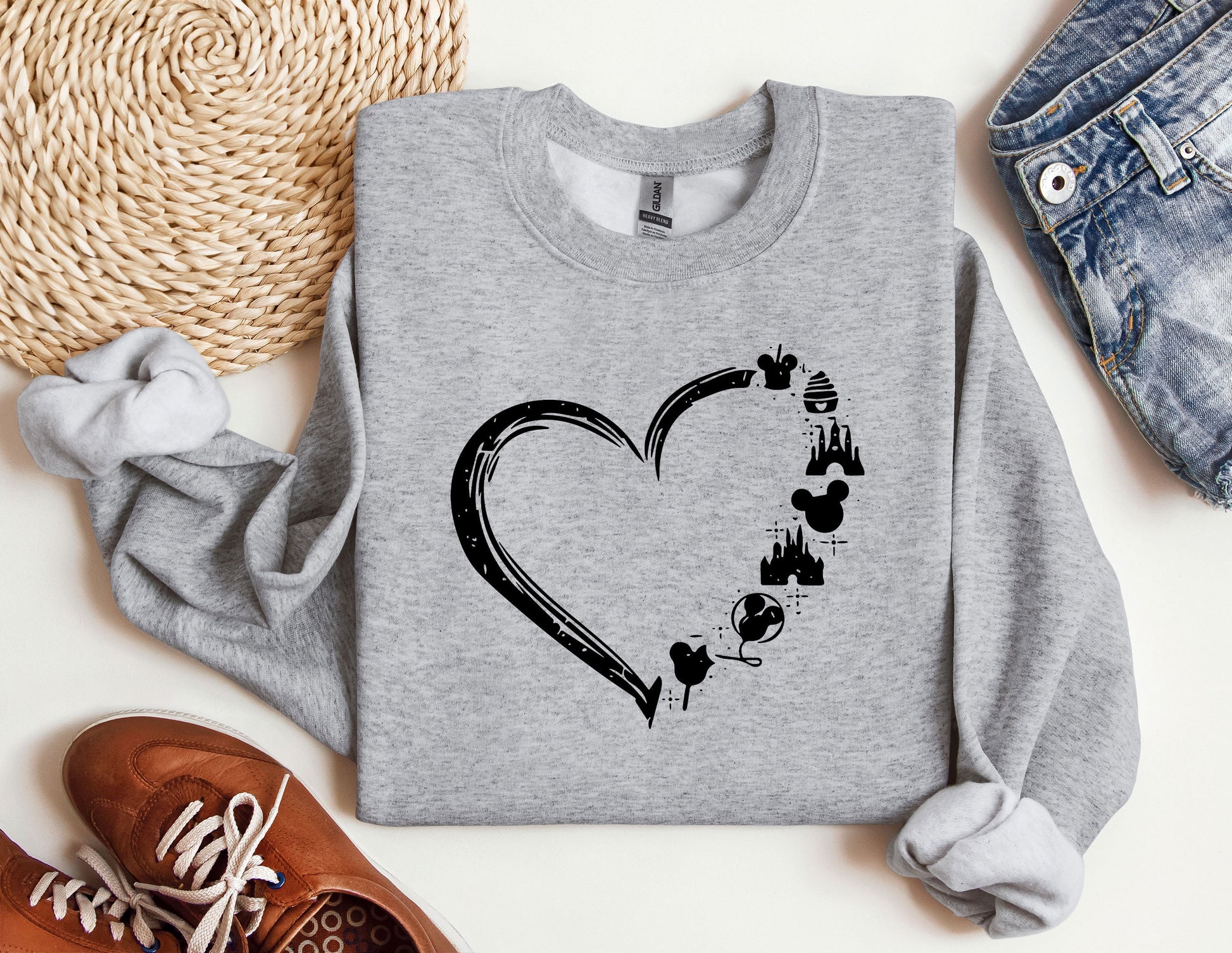 a sweatshirt with a heart and paw prints on it