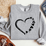 a sweatshirt with a heart and paw prints on it