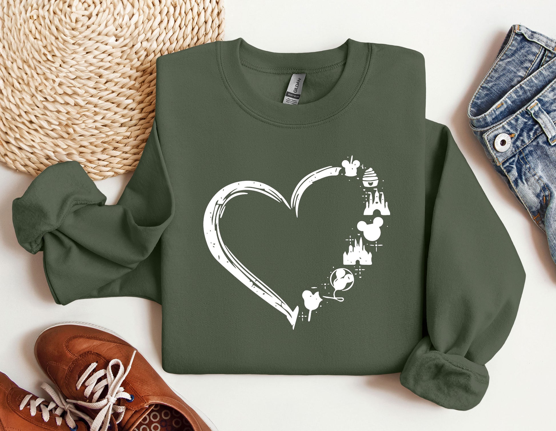 a green sweatshirt with a heart drawn on it