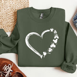 a green sweatshirt with a heart drawn on it