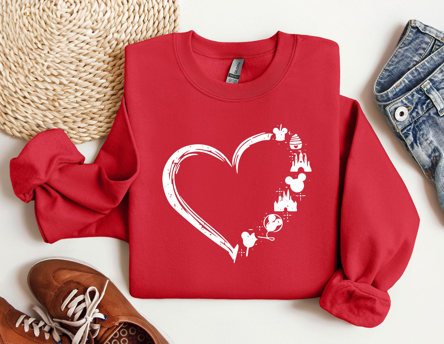 a red sweatshirt with a heart and mickey mouses on it