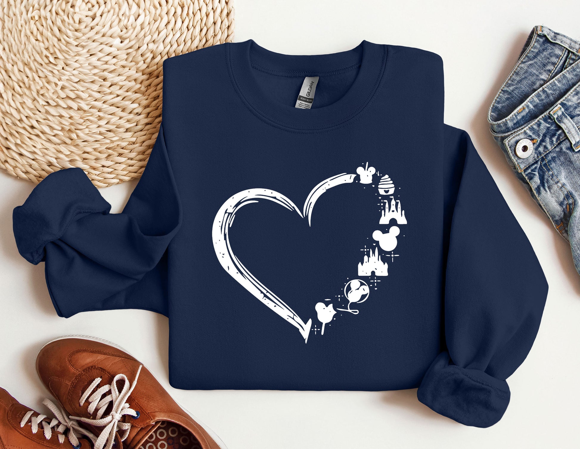 a blue sweatshirt with a heart drawn on it